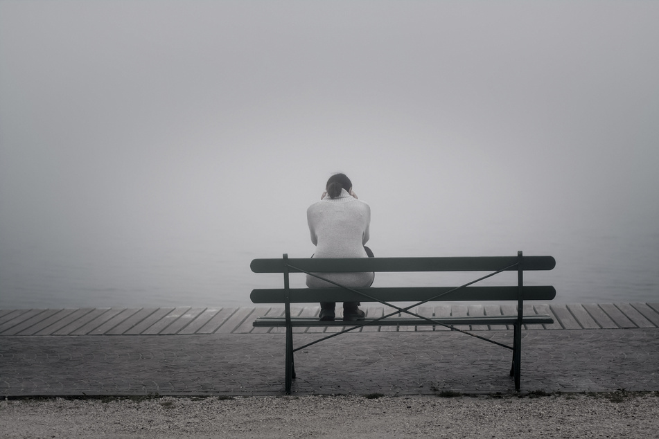 Lonely woman on a bench