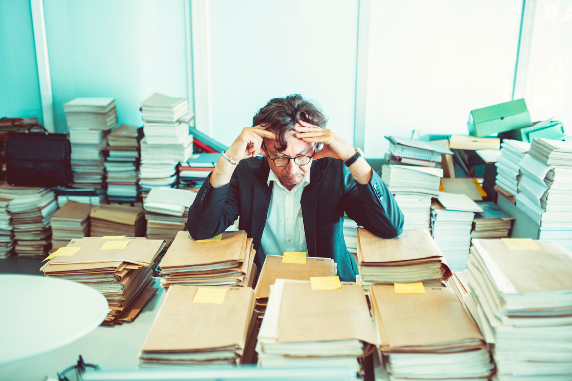 Overworked office worker, bureaucracy, archives